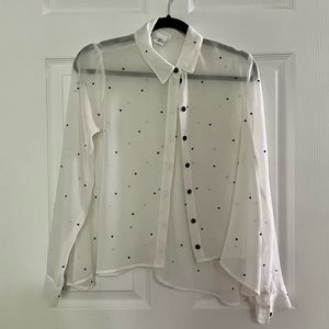 See through white button down blouse with black gemstones. Size small.